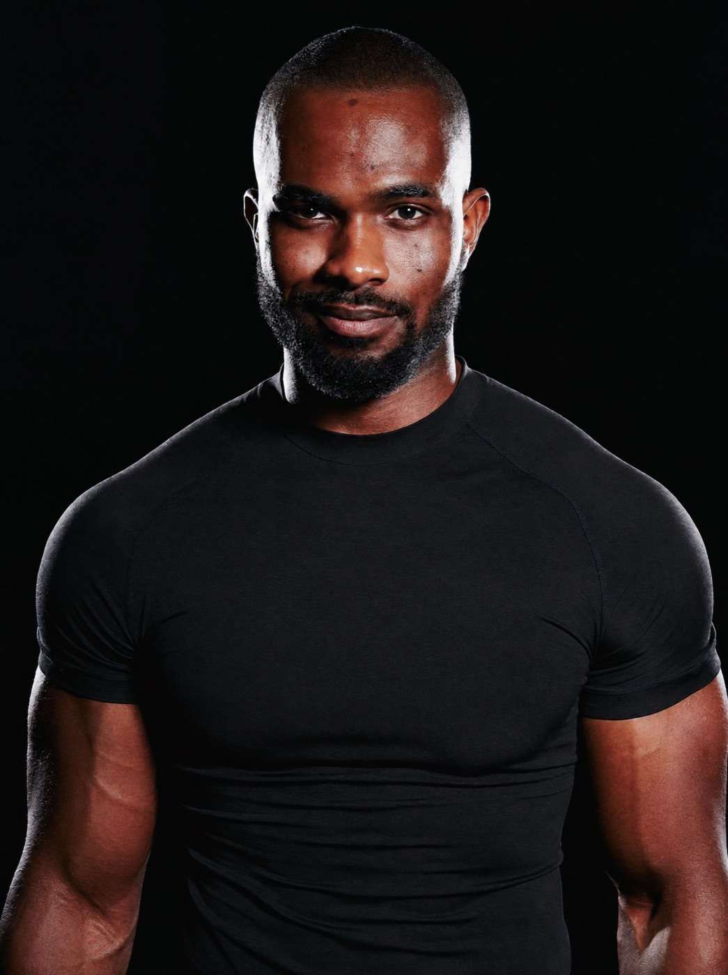 AXEL, EYEGASMIC AI coach for strength, in an obsidian compression shirt